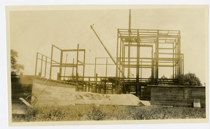 With funding secured in 1919, it wouldn’t be until 1922 that real movement started on a new fireproof
library building. In September of that year, the Board approved architectural plans by Proudfoot, Bird,
and Rawson, and the next month, the ground was cleared, and excavation started for the foundation.
The following spring, the foundation was poured, and the ironwork for the superstructure began going
up. On October 11, 1923, an informal ceremony was held for the laying of the cornerstone of the
building. Classes were dismissed at 11:30, followed by short speeches by a number of dignitaries, and a
time capsule was placed in the cornerstone.