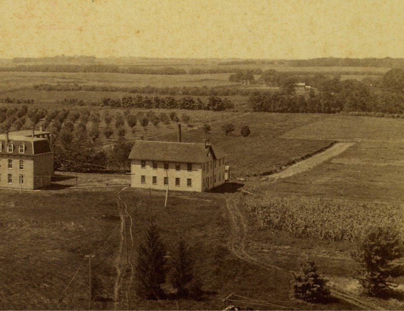 The Workshop was built in 1870 at the request of President Welch for a space large enough to accommodate students who take Mechanic Arts courses. The two-story structure included an engine house and two laundry rooms until it was moved in 1885, at which point the laundry rooms were torn down and rebuilt. By 1894, the building was called The Carpenter and Pattern Shop and had experienced several small additions. Concerns for the condition of the Workshop were raised in 1893, but the building was not removed until 1898, after the completion of Building 'A' and the Carpenter Shop. 