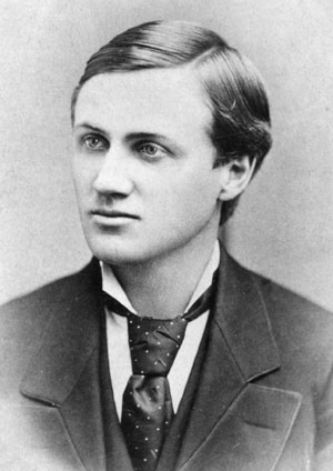Young white man with slicked hair and big necktie