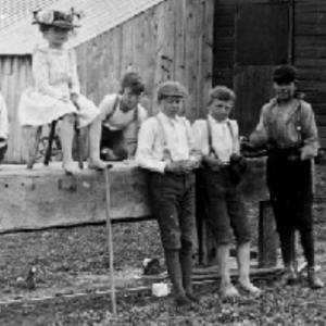 Black and white image of a group of four boys and one girl of President Beardshear's family and friends 
